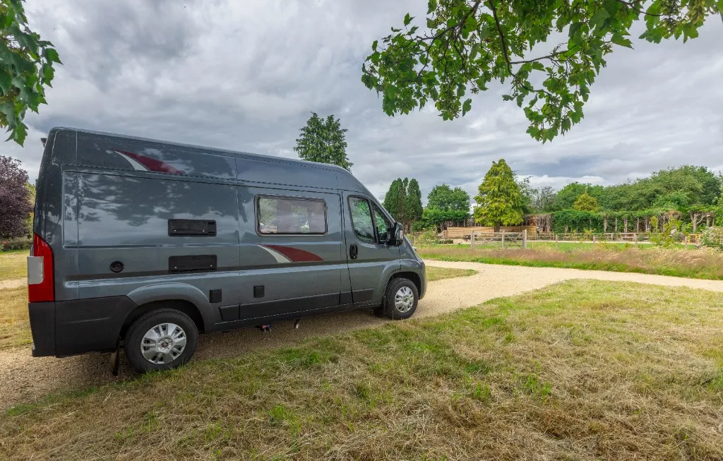 Dark grey motorhome on a hardstanding pitch