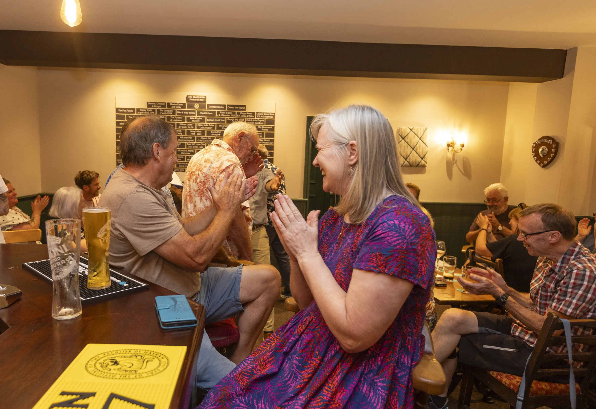 Guests on their feet clapping during an evening at The Black Lion
