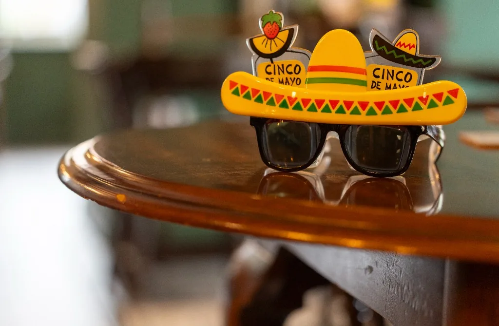 Novelty sombrero sunglasses on a table