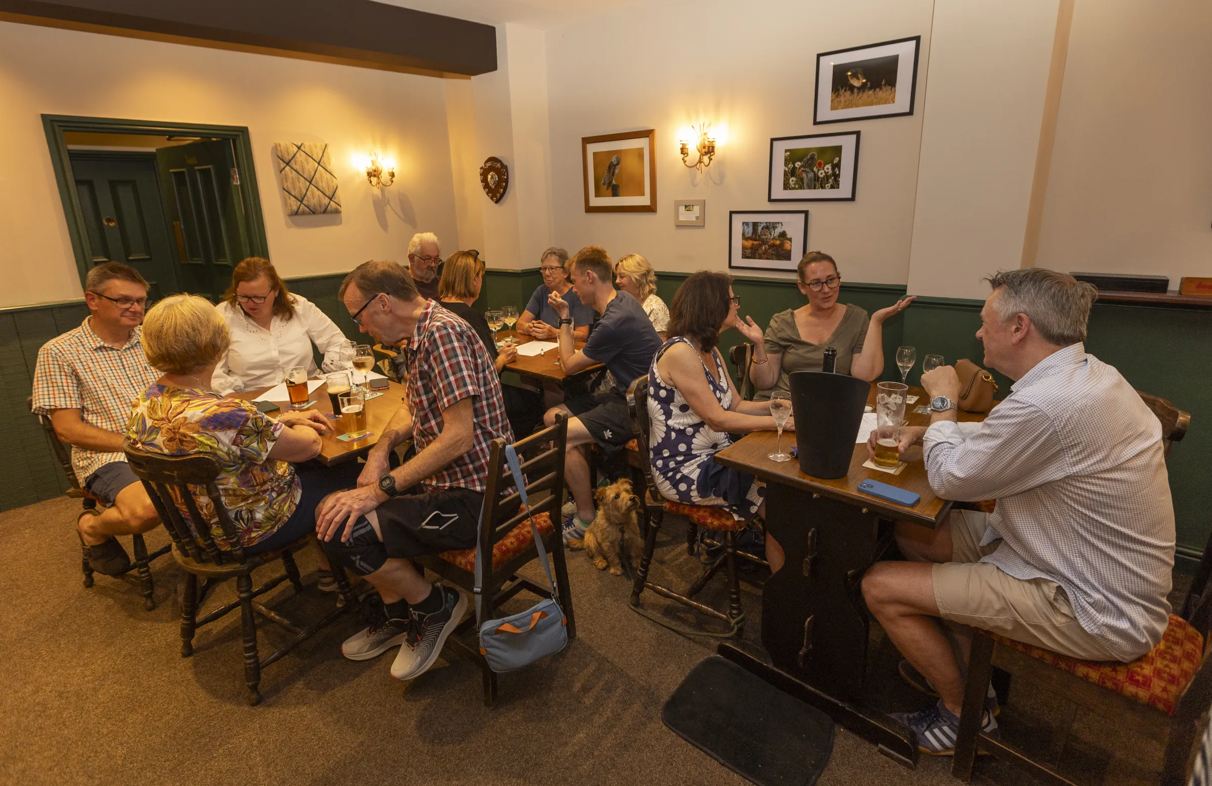 Quiz tables filled with papers, pints and conversation at The Black Lion