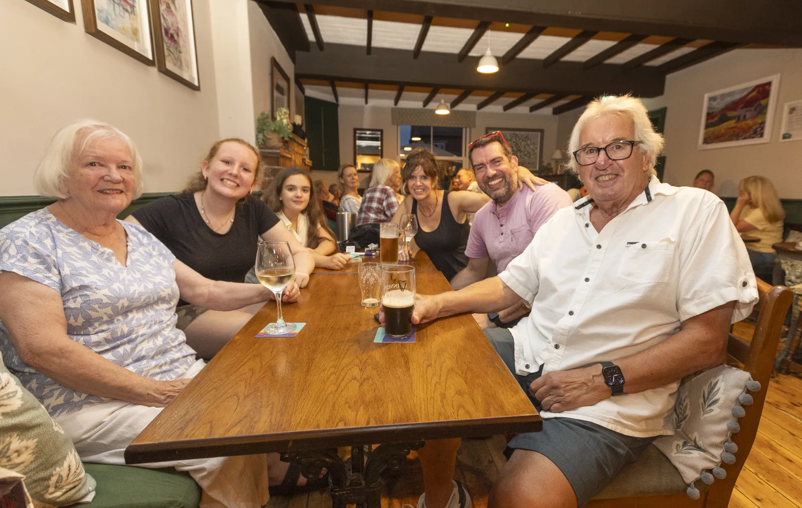 A mixed-age quiz team enjoying an evening at The Black Lion