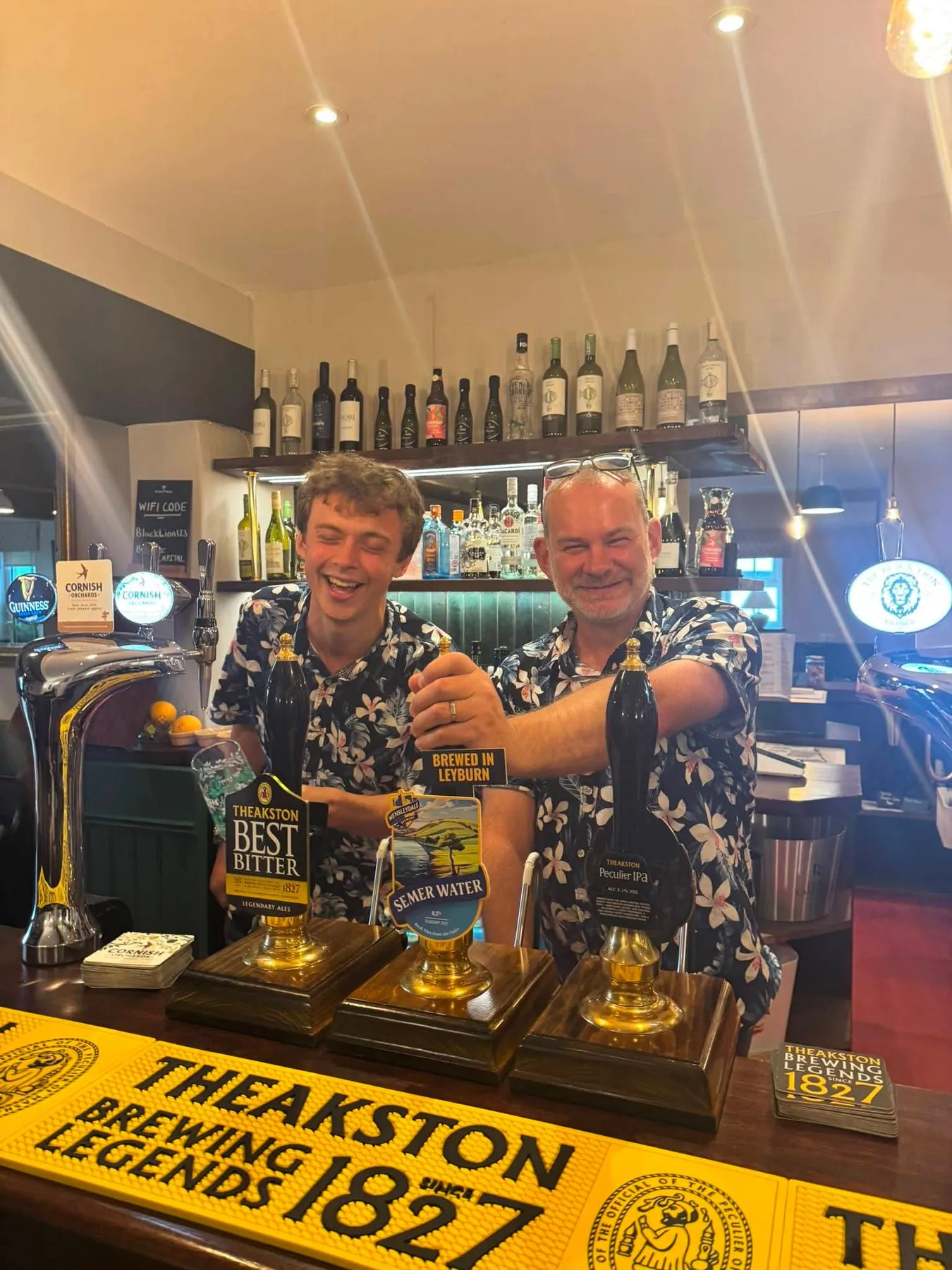 Henry, left, and Mike, right, behind the bar at The Black Lion